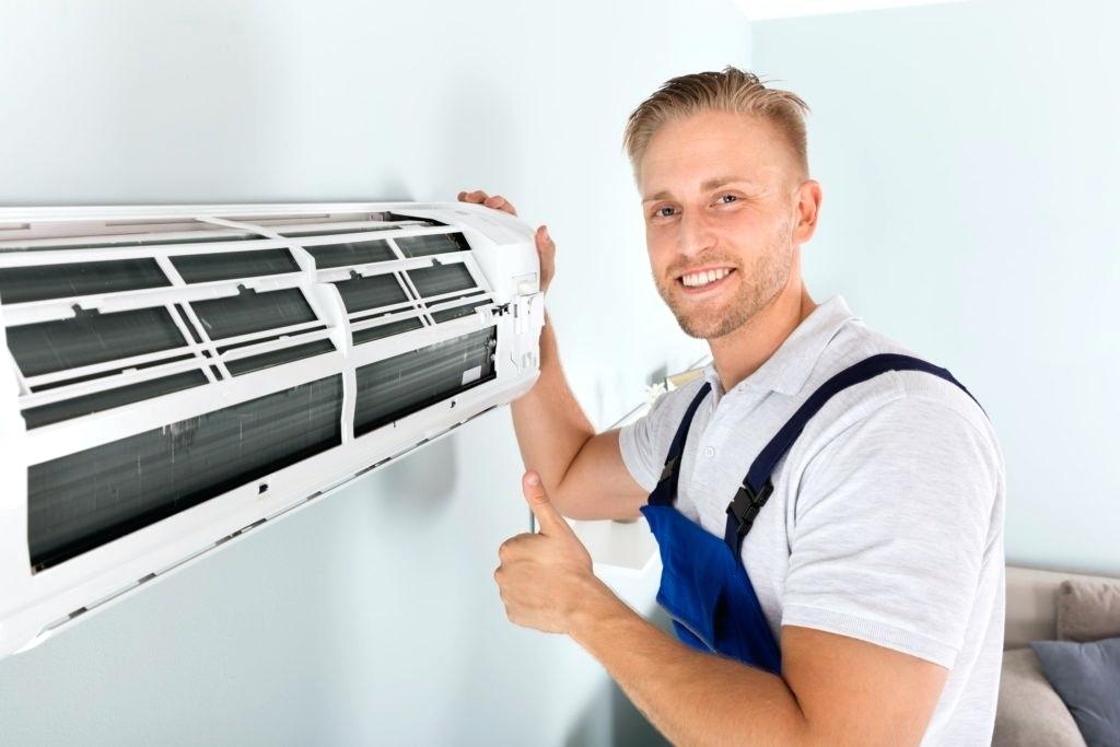 paramount-plumbing-and-heating-a-technician-working-on-air-conditioning-in-new.jpg