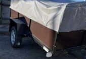Новий автомобільний причіп 210х130х43 баклеітовий