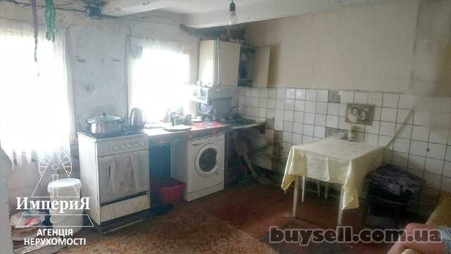 Продам кирпичный дом на два входа со всеми коммуникациями.