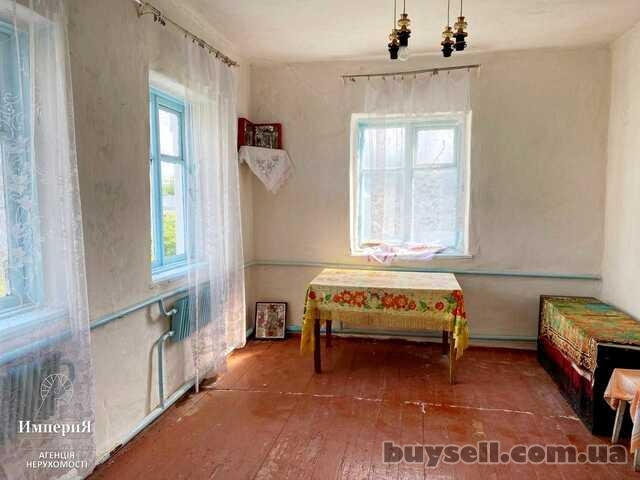 Продам кирпичный дом в Центре села Великополовецкое.Участок 65 соток.
