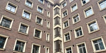 Облицювальна плитка для фасаду будинку: матеріали, види та технології монтажу